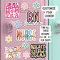 a pink refrigerator with lots of stickers on it