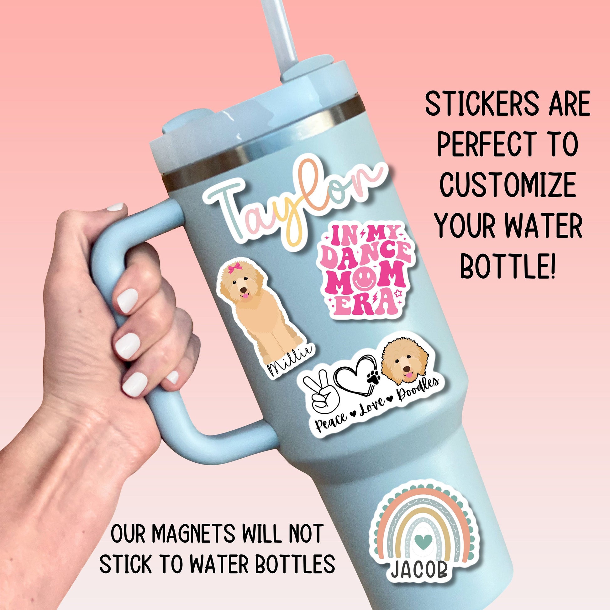 a person holding a cup with stickers on it